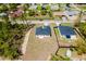 New construction home boasts a modern design, dark roof, and ample lawn space in a developing neighborhood at 2596 Sw 146 St, Ocala, FL 34473