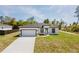Charming single-story home with a well-manicured lawn and long driveway at 2596 Sw 146 St, Ocala, FL 34473