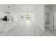 Bright open-concept living area with modern appliances and light-colored floor at 2596 Sw 146 St, Ocala, FL 34473