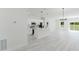 Bright, open-concept living area with a modern kitchen and ample natural light at 2596 Sw 146 St, Ocala, FL 34473