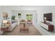 Inviting living room with stylish furniture, neutral tones, and abundant natural light at 2596 Sw 146 St, Ocala, FL 34473