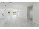 Open-concept living area featuring modern lighting, light-colored floors, and plenty of space at 2596 Sw 146 St, Ocala, FL 34473