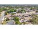 Enjoy a panoramic view of the neighborhood, highlighting the property's desirable location near a scenic lake and lush trees at 2685 Groveland Ave, Deltona, FL 32725