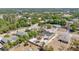 The aerial view showcases the property's backyard, complemented by mature trees and neighborhood charm at 2685 Groveland Ave, Deltona, FL 32725