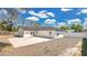Rear exterior showcasing a concrete patio and a well-maintained white exterior at 2685 Groveland Ave, Deltona, FL 32725