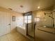 Well-lit bathroom featuring a glass-enclosed shower and soaking tub at 2840 Roccella Ct, Kissimmee, FL 34747