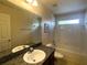 Bathroom features a vanity with sink, a shower and tub combination, and a toilet at 2840 Roccella Ct, Kissimmee, FL 34747