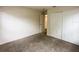 Neutral bedroom with carpet, closet, and open door at 2840 Roccella Ct, Kissimmee, FL 34747