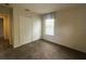 Comfortable bedroom with carpet, closet, and bright window at 2840 Roccella Ct, Kissimmee, FL 34747