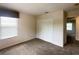 Cozy bedroom features plush carpeting, a window with blinds, and ample closet space at 2840 Roccella Ct, Kissimmee, FL 34747