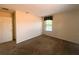 Neutral bedroom with window providing natural light, and carpeted flooring at 2840 Roccella Ct, Kissimmee, FL 34747