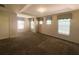 Large bedroom featuring a tray ceiling and multiple windows, bright and airy at 2840 Roccella Ct, Kissimmee, FL 34747