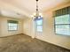 Dining room with a chandelier and large windows at 2840 Roccella Ct, Kissimmee, FL 34747