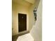 Entry door with a keypad lock and decorative wall mounted lamp at 2840 Roccella Ct, Kissimmee, FL 34747