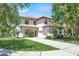 Charming two-story home with a well-manicured lawn, a red tile roof, and an attached two-car garage at 2840 Roccella Ct, Kissimmee, FL 34747