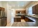 Spacious kitchen with ample counter space, an island and stainless steel appliances at 2840 Roccella Ct, Kissimmee, FL 34747