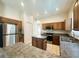Bright kitchen with an island, stainless steel appliances, and tiled flooring at 2840 Roccella Ct, Kissimmee, FL 34747