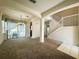 Living room leading to a screened-in patio and stairs at 2840 Roccella Ct, Kissimmee, FL 34747
