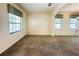 Bright living room with multiple windows and neutral carpet at 2840 Roccella Ct, Kissimmee, FL 34747