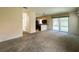 Living room showing access to kitchen and screened-in patio with pool at 2840 Roccella Ct, Kissimmee, FL 34747