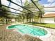 Relax in this screened-in pool with a patio, surrounded by a lush, well-maintained lawn at 2840 Roccella Ct, Kissimmee, FL 34747
