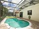 Screened pool with brick patio offers a refreshing oasis for relaxation and outdoor enjoyment at 2840 Roccella Ct, Kissimmee, FL 34747