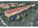 Overview of residential community with fenced patios, palm trees, and manicured lawns at 3020 Red Ginger Rd, Kissimmee, FL 34747