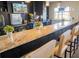 Bar with a granite countertop and bar stools at 3020 Red Ginger Rd, Kissimmee, FL 34747