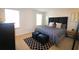 Comfortable bedroom features a padded headboard, stylish rug and natural light from two windows at 3020 Red Ginger Rd, Kissimmee, FL 34747