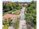 Gated community entrance with a guard house and fountain at 3020 Red Ginger Rd, Kissimmee, FL 34747
