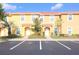 Attractive townhome exteriors feature colorful walls, red tiled roofs, and well-maintained landscaping at 3020 Red Ginger Rd, Kissimmee, FL 34747