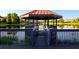 Picturesque gazebo overlooking a tranquil lake, perfect for relaxation and enjoying nature at 3020 Red Ginger Rd, Kissimmee, FL 34747