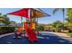 Fun playground featuring slides, climbing structures, and shaded seating areas at 3020 Red Ginger Rd, Kissimmee, FL 34747