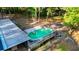 Aerial view of the backyard with in-ground pool and wooden deck surrounded by lush greenery at 30542 Hoylake St, Sorrento, FL 32776