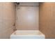 Bathroom featuring tiled walls and a white bathtub at 30542 Hoylake St, Sorrento, FL 32776