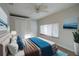 Bedroom showcasing wood-look floors, a ceiling fan, closet, and a window, designed to be a comfortable living space at 30542 Hoylake St, Sorrento, FL 32776