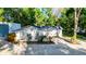 Charming home with mature trees, well-maintained landscaping, and a gravel driveway at 30542 Hoylake St, Sorrento, FL 32776
