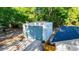 Large metal outbuilding or shed featuring gravel driveway and lush foliage at 30542 Hoylake St, Sorrento, FL 32776