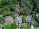 Aerial view of the home and private backyard with screened in pool and mature trees at 320 Remington Dr, Oviedo, FL 32765