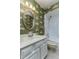Charming bathroom featuring patterned wallpaper and vanity sink at 320 Remington Dr, Oviedo, FL 32765
