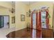 Elegant dining room featuring hardwood floors, high ceilings, chandelier, and decorative window treatments at 320 Remington Dr, Oviedo, FL 32765