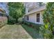 Exterior view of house with grassy yard and lush landscaping at 320 Remington Dr, Oviedo, FL 32765