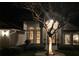 Inviting home exterior with elegant columns, arched windows, and landscaped garden at 320 Remington Dr, Oviedo, FL 32765
