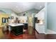 Bright, updated kitchen with stainless steel appliances, custom cabinets, and an island with a quartz countertop at 320 Remington Dr, Oviedo, FL 32765