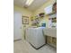 Functional laundry room features a washer, dryer, and utility sink at 320 Remington Dr, Oviedo, FL 32765