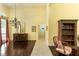 Grand living room featuring hardwood floors, tall ceilings, and an antique chandelier at 320 Remington Dr, Oviedo, FL 32765