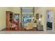 Comfortable living room with hardwood floors and sliding glass doors to the screened lanai at 320 Remington Dr, Oviedo, FL 32765