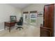 Bright office space with a desk, natural light, and a view of the neighborhood at 320 Remington Dr, Oviedo, FL 32765