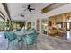 Spacious covered patio featuring a dining area and serene outdoor living space at 320 Remington Dr, Oviedo, FL 32765