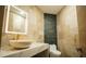 Modern bathroom with stone accents, illuminated mirror, and elegant vessel sink at 32325 State Road 44, Eustis, FL 32736